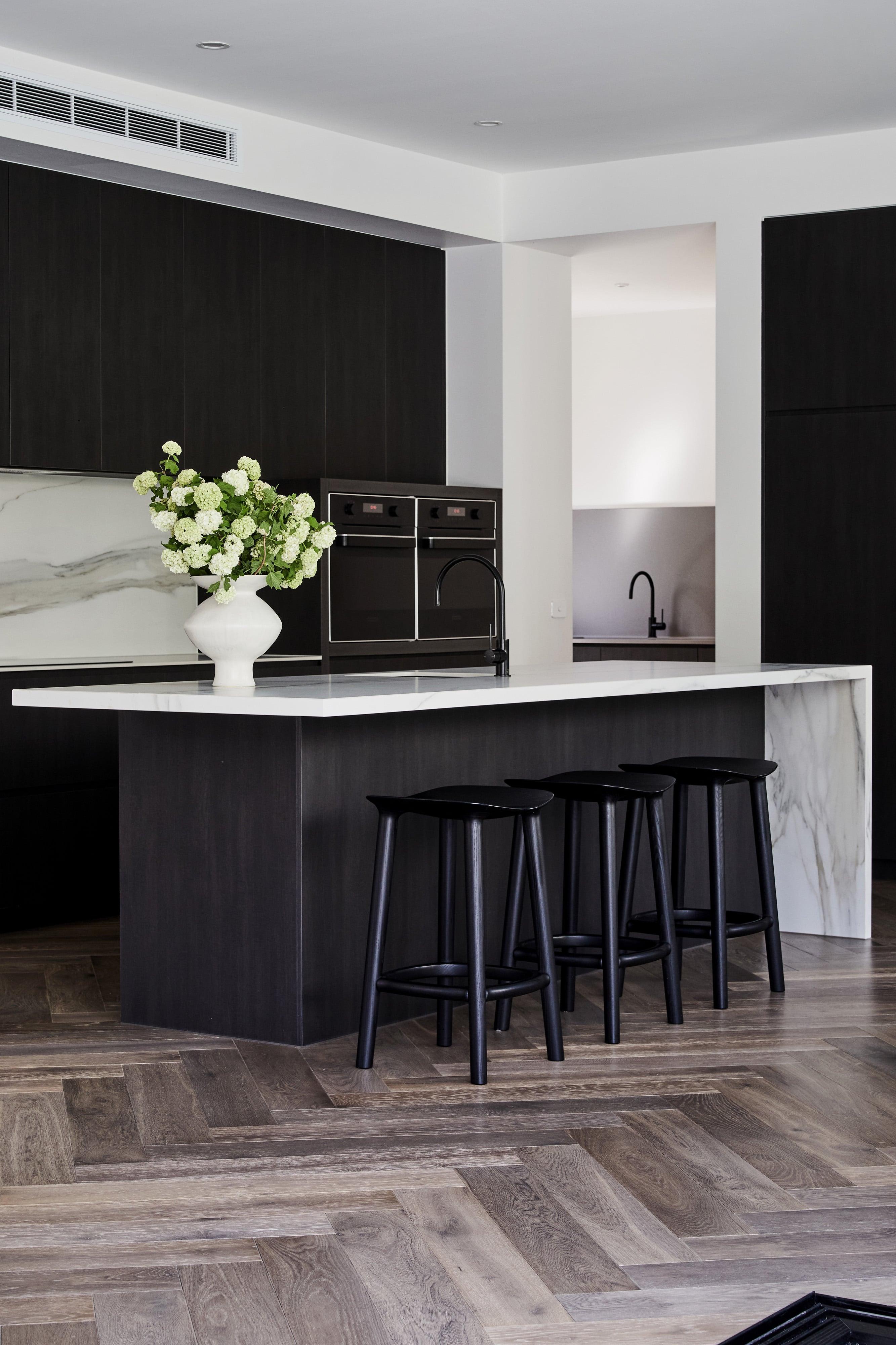 modern kitchen with herringbone timber floors