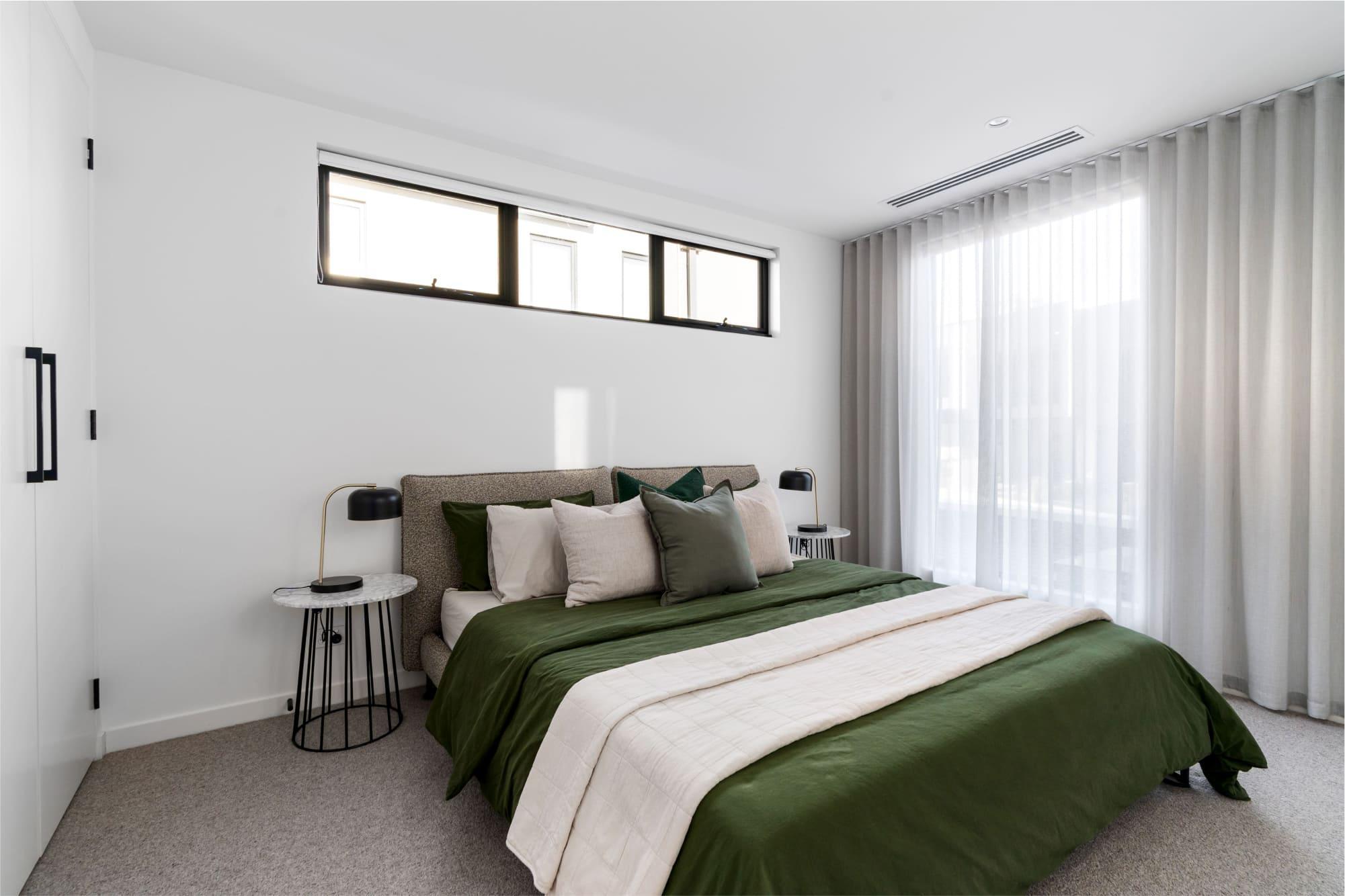 A modern bedroom with a tonal colour palette