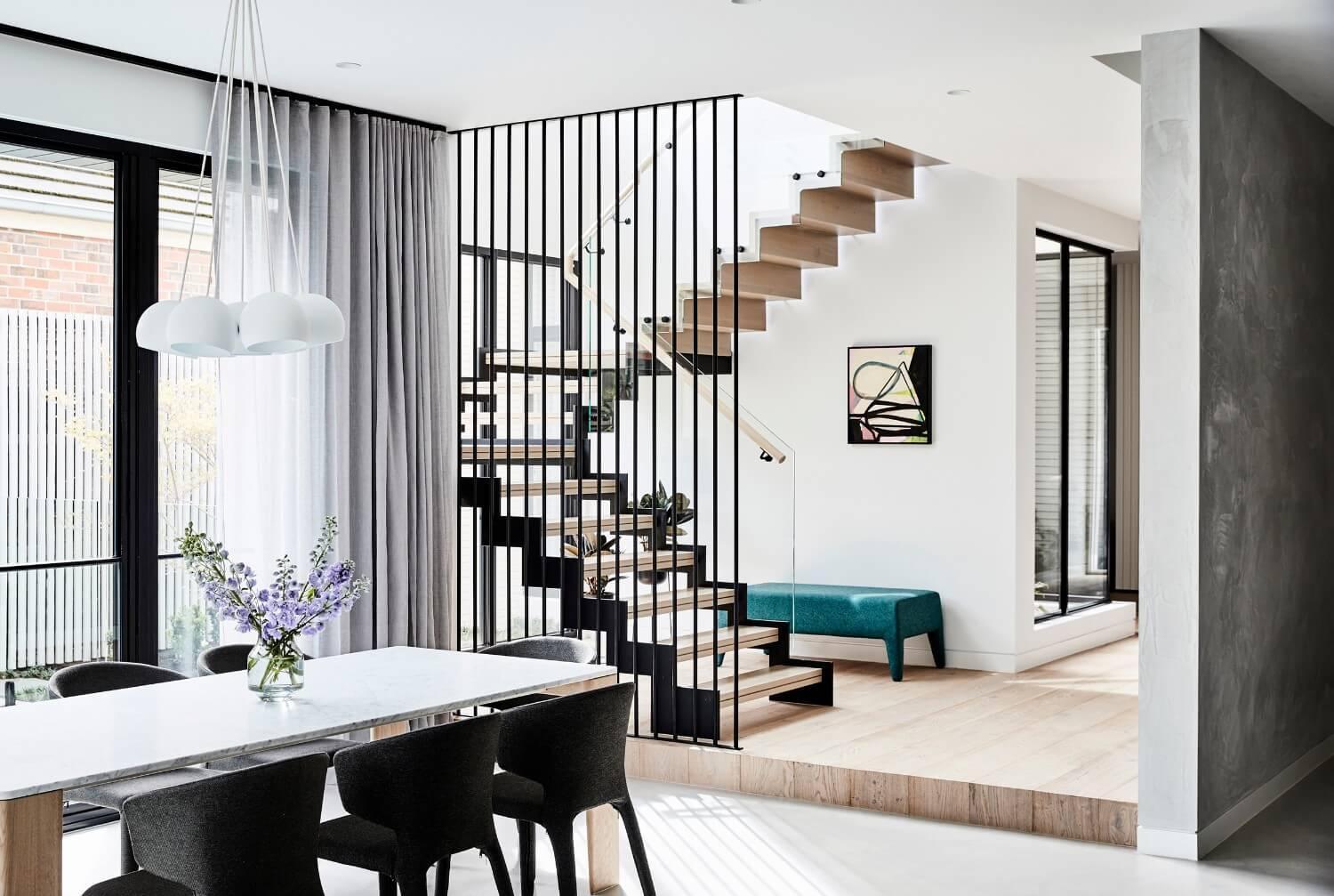 Contemporary Floating Staircase And Black Metal Screen