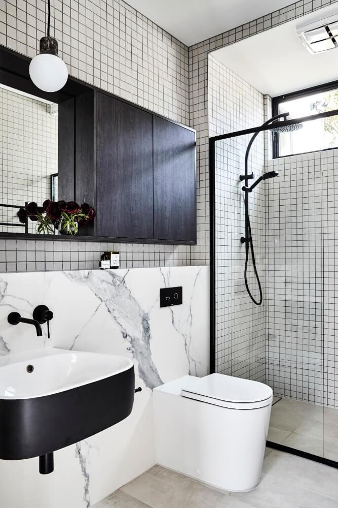 Contrasting Black Vanity, Cabinets And Fittings In Modern Clean Bathroom