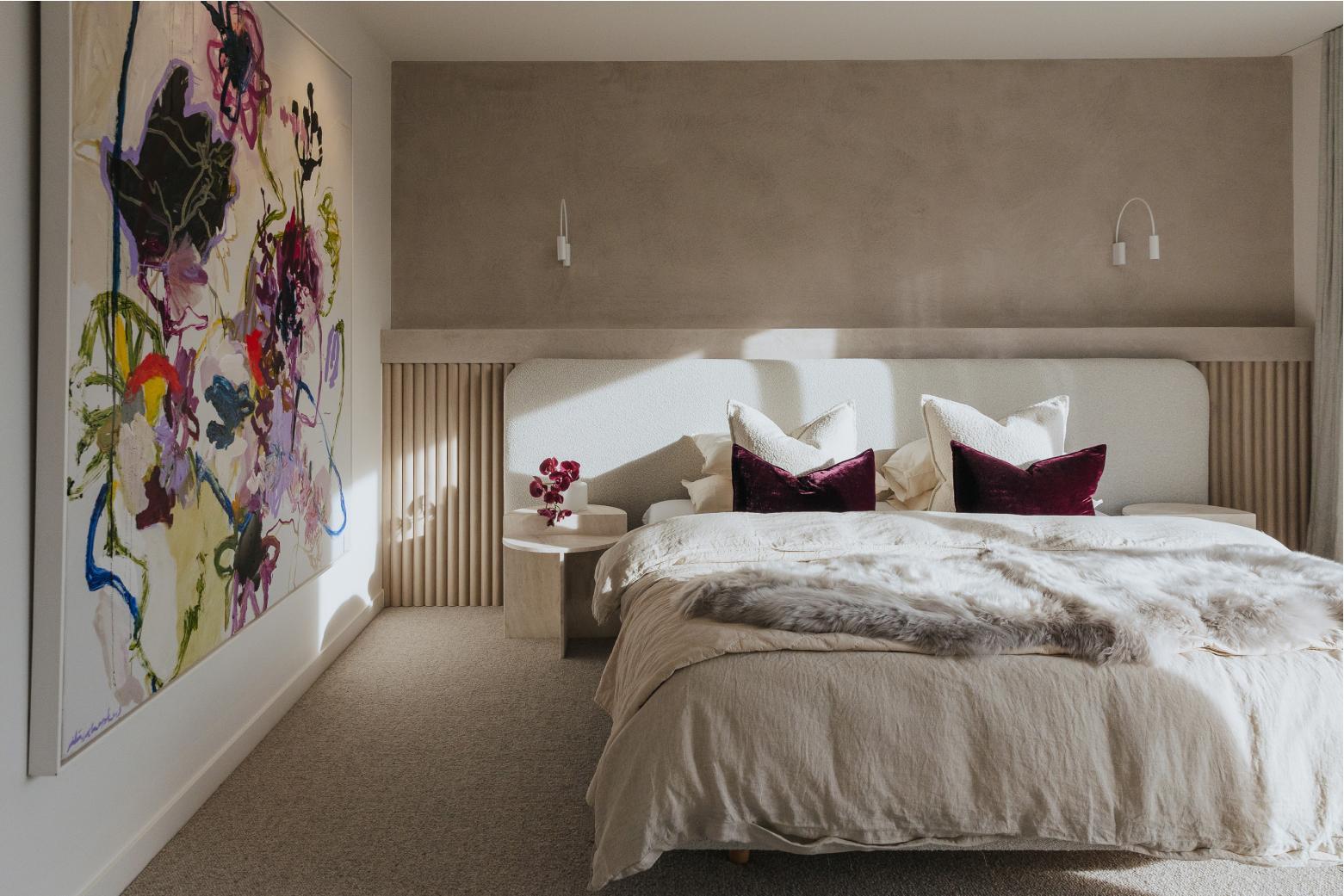 Masterbedroom with large brightly coloured artwork