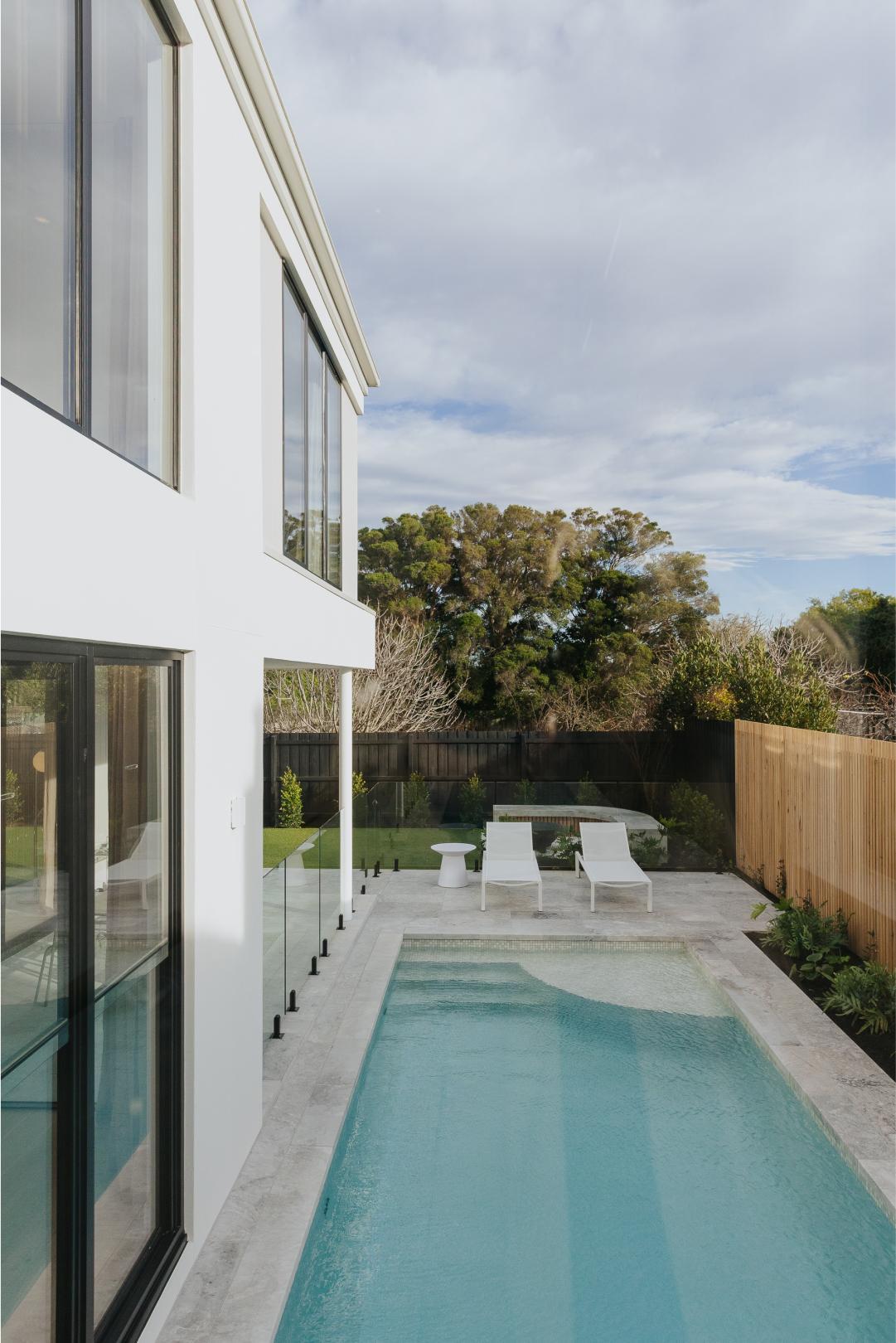 exterior pool beside modern house