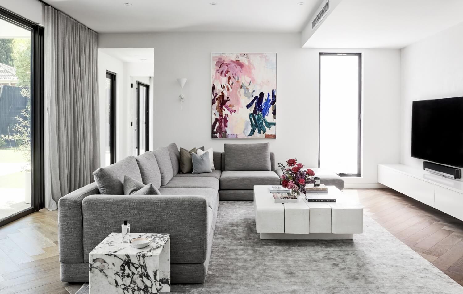 Artwork Adds A Pop Of Colour To Muted Furniture And Materials In Living Room