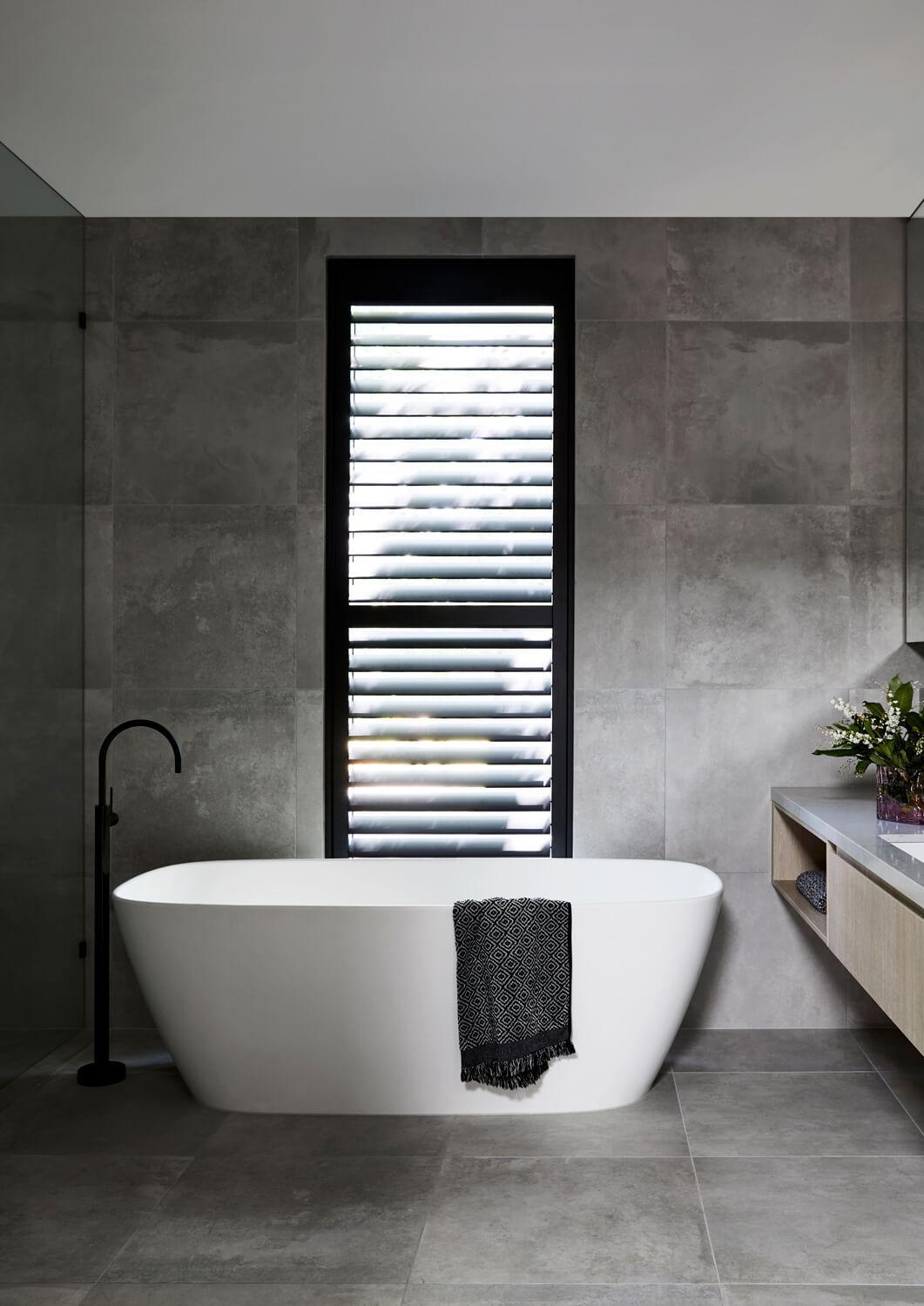 Freestanding Tub With Black Fittings And Window Shutters