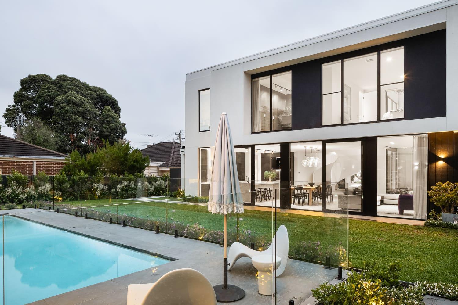 exterior facade of modern residential home with pool 