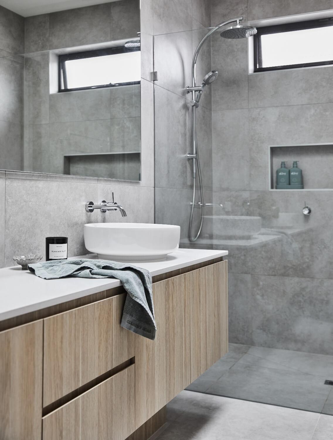 Modern Bathroom With Light Wood And Grey Tiling Selection