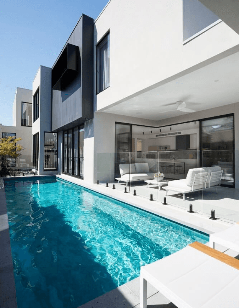Back facade of a modern home with a pool